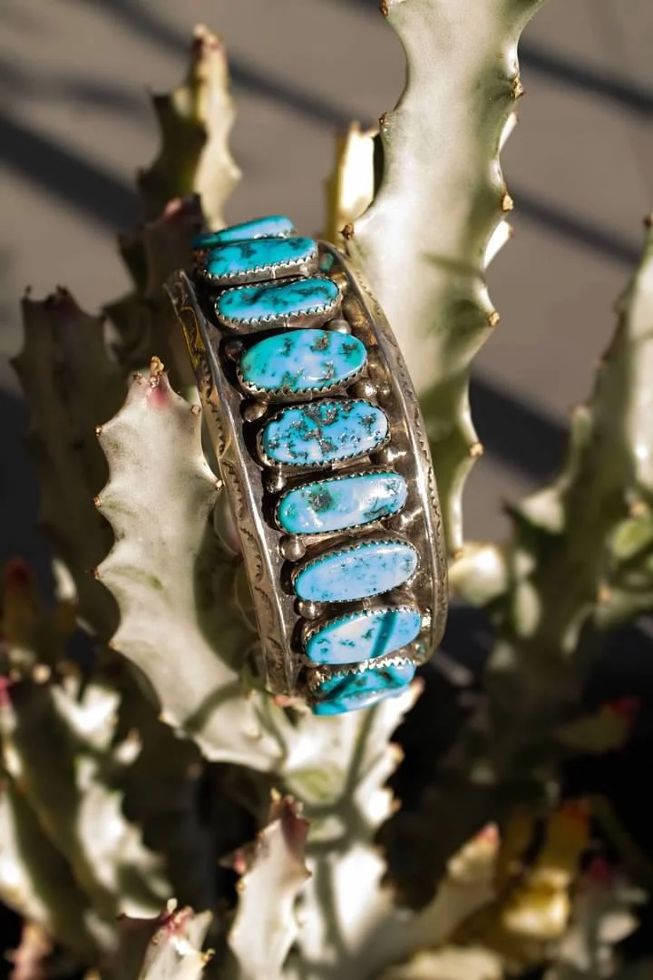 Kingman turquoise row cuff in sterling silver, photographed outside our shop at 4th and Beale